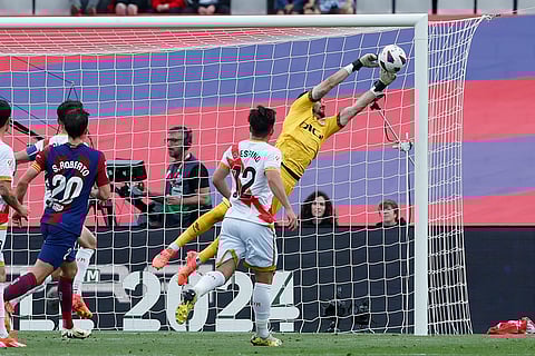 Rayo's goalkeeper Stole Dimitrievski makes a save